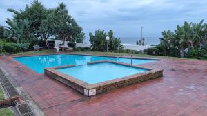 a large swimming pool on top of a brick yard at Laguna La Crete 225 in Margate