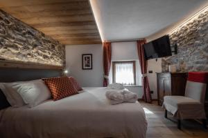 Postel nebo postele na pokoji v ubytování Les Plaisirs d'Antan