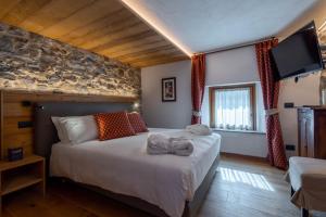 Postel nebo postele na pokoji v ubytování Les Plaisirs d'Antan