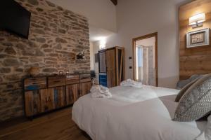 Postel nebo postele na pokoji v ubytování Les Plaisirs d'Antan