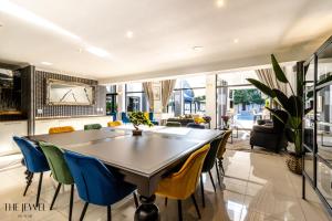 a dining room with a table and chairs at The Jewel B&B in Cape Town