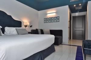 Postel nebo postele na pokoji v ubytování Hotel Royal Positano