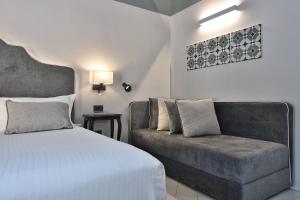 Postel nebo postele na pokoji v ubytování Hotel Royal Positano