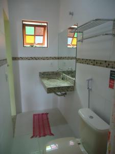 Kylpyhuone majoituspaikassa Harmoni Hostel & Pousada