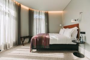 Postel nebo postele na pokoji v ubytování 1908 Lisboa Hotel