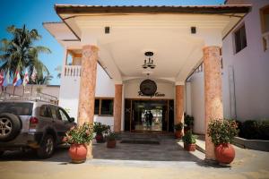 a car parked in front of a building at Mansea Beach Hotel in Kololi