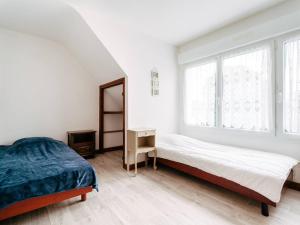 En eller flere senge i et værelse på Appartement Carnac, 3 pièces, 4 personnes - FR-1-477-100