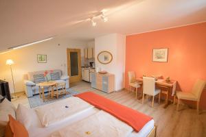 a living room with a couch and a table at Ferienwohnung Alpennelke in Füssen