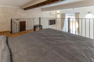 a bedroom with a bed and a balcony at Solmi Home in Modena