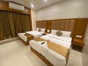 Ένα ή περισσότερα κρεβάτια σε δωμάτιο στο Hotel BKC Inn - Near Trade Center, Visa Consulate BKC
