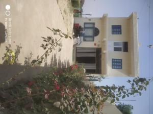 a building with a plant in front of it at Braj Waterpark & Resort in Kannauj