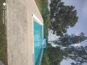 una piscina al lado de un edificio en Braj Waterpark & Resort en Kannauj