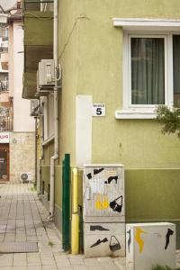 a refrigerator on the side of a building at Grand Relax Cape Cod by RV Apartments in Varna City