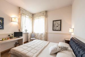 Un pat sau paturi într-o cameră la Ristorante Albergo Ca' Vittoria