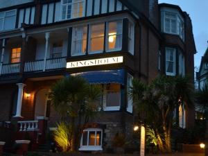 a building with a sign that reads kickington iv at Kingsholm Guest House in Torquay