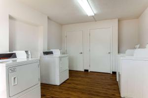 an empty room with a washer and dryer at La Quinta Inn Tampa Airport Stadium Westshore in Tampa