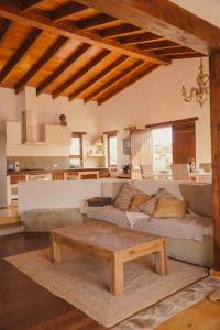a living room with a couch and a coffee table at Casa Maja in Lajares