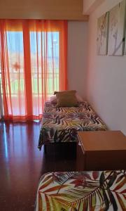 Postel nebo postele na pokoji v ubytování Precioso apartamento con vistas al mar con piscina + 8 fotografií