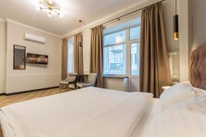 Posteľ alebo postele v izbe v ubytovaní Design Apartment on Mykhailivskyi Ln. 4
