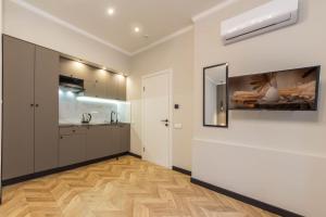 Kuchyňa alebo kuchynka v ubytovaní Design Apartment on Mykhailivskyi Ln. 4