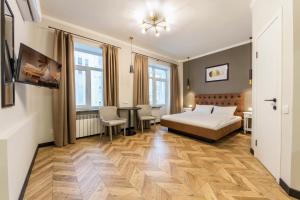 Posteľ alebo postele v izbe v ubytovaní Design Apartment on Mykhailivskyi Ln. 4 + 16 fotografií