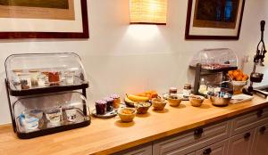 a counter with a bunch of food on it at Manoir de Daubeuf in Daubeuf-Serville