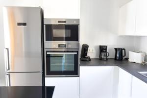 a kitchen with a stainless steel oven and appliances at Villa Reyets 4 bed 3 bath Private Pool in Busot