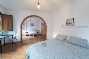 Llit o llits en una habitació de Un Lugar House San Telmo -Coliving