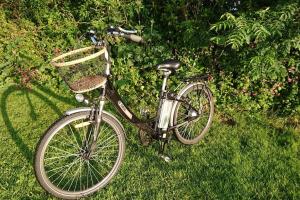 a bike parked in the grass in a yard at Tiny House on isolated farm by the Cornish Coast in Bude