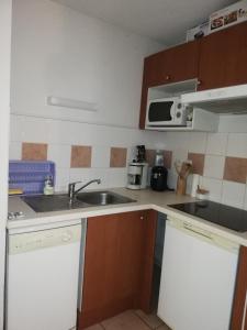 Kuchnia lub aneks kuchenny w obiekcie Appartement les chalets d estives