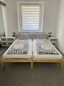 Кровать или кровати в номере Penzion Puk