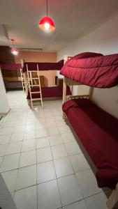 Postel nebo postele na pokoji v ubytování HOSTEL ARRAYAN BARILOCHE