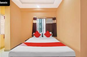 Cama o camas de una habitación en SWAGATAM HOTEL