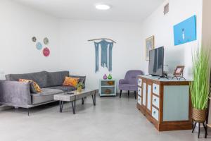 TV a/nebo společenská místnost v ubytování bloom