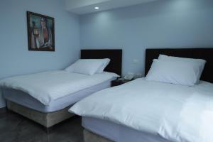 Rúm í herbergi á Mount of Olives Hotel