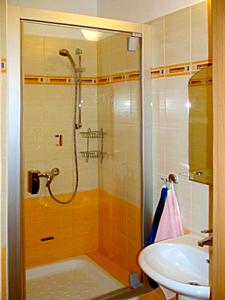 a bathroom with a shower and a sink at Apartmán Oščadnica in Oščadnica