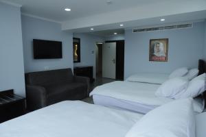 Rúm í herbergi á Mount of Olives Hotel