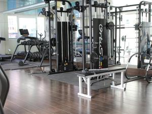 a gym with a bunch of equipment in it at The Great Valencia Stay in Valencia