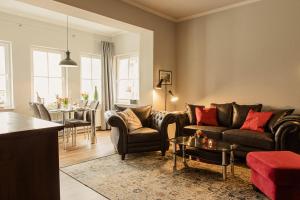 a living room with a couch and a table at Villa Morgentau in Zinnowitz