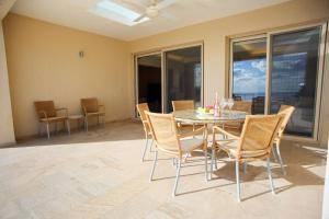 a dining room with a table and chairs at Seafront 5 Bedroom Villa Paradise in Sea Caves in Peyia