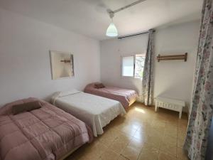 A bed or beds in a room at Ca´Conchita