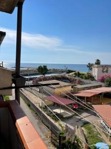 a view of a building with the ocean in the background at Il Bacio del Mare in Agropoli