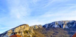 a view of a mountain with a house in front of it at Konak -Guest house -Ramonda Serbika in Niš