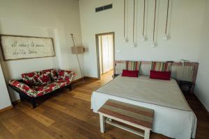 A bed or beds in a room at Prime Alture Wine Resort
