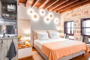 Postel nebo postele na pokoji v ubytování Mandorla Apartments