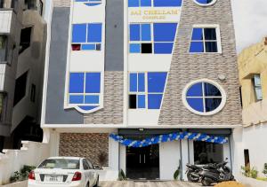 a building with a car parked in front of it at Chellam Residency in Chennai +18 photos
