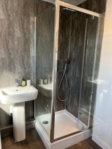 a bathroom with a shower and a sink at Beck View House in Stockton-on-Tees