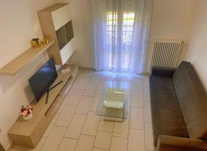 a living room with a couch and a table at Casa R&E in Valbrona