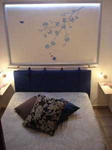 Ένα ή περισσότερα κρεβάτια σε δωμάτιο στο Villa Aurea