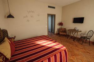 A bed or beds in a room at Prime Alture Wine Resort